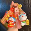 Fortune and lucky cat blue cat keychains shown as bag charms