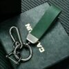 Green leather car keychain with metal clip