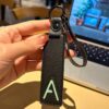 A initial leather keychain in black