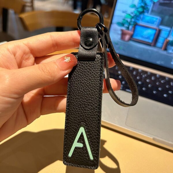 A initial leather keychain in black