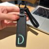D initial leather keychain in black