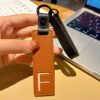 F initial leather keychain in brown