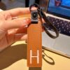 H initial leather keychain in brown