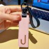 J initial leather keychain in pink