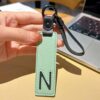 N initial leather keychain in green