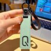 Q initial leather keychain in green